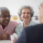 Elder law attorney talking to senior couple about their in-home care needs
