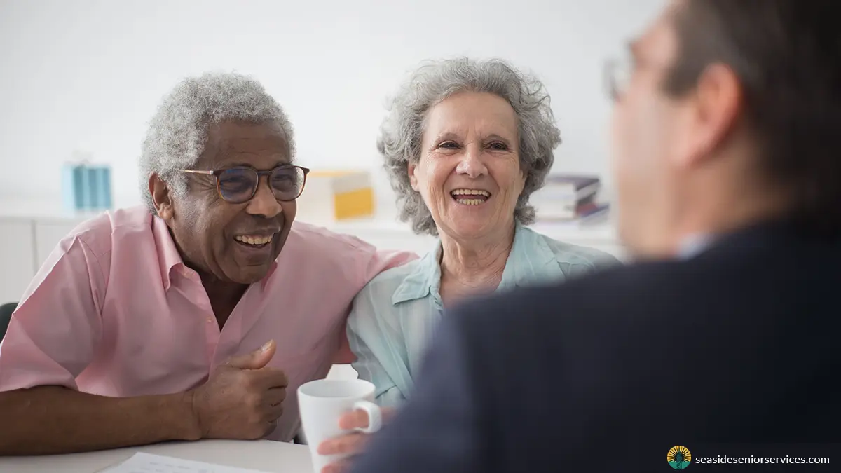 Elder law attorney talking to senior couple about their in-home care needs
